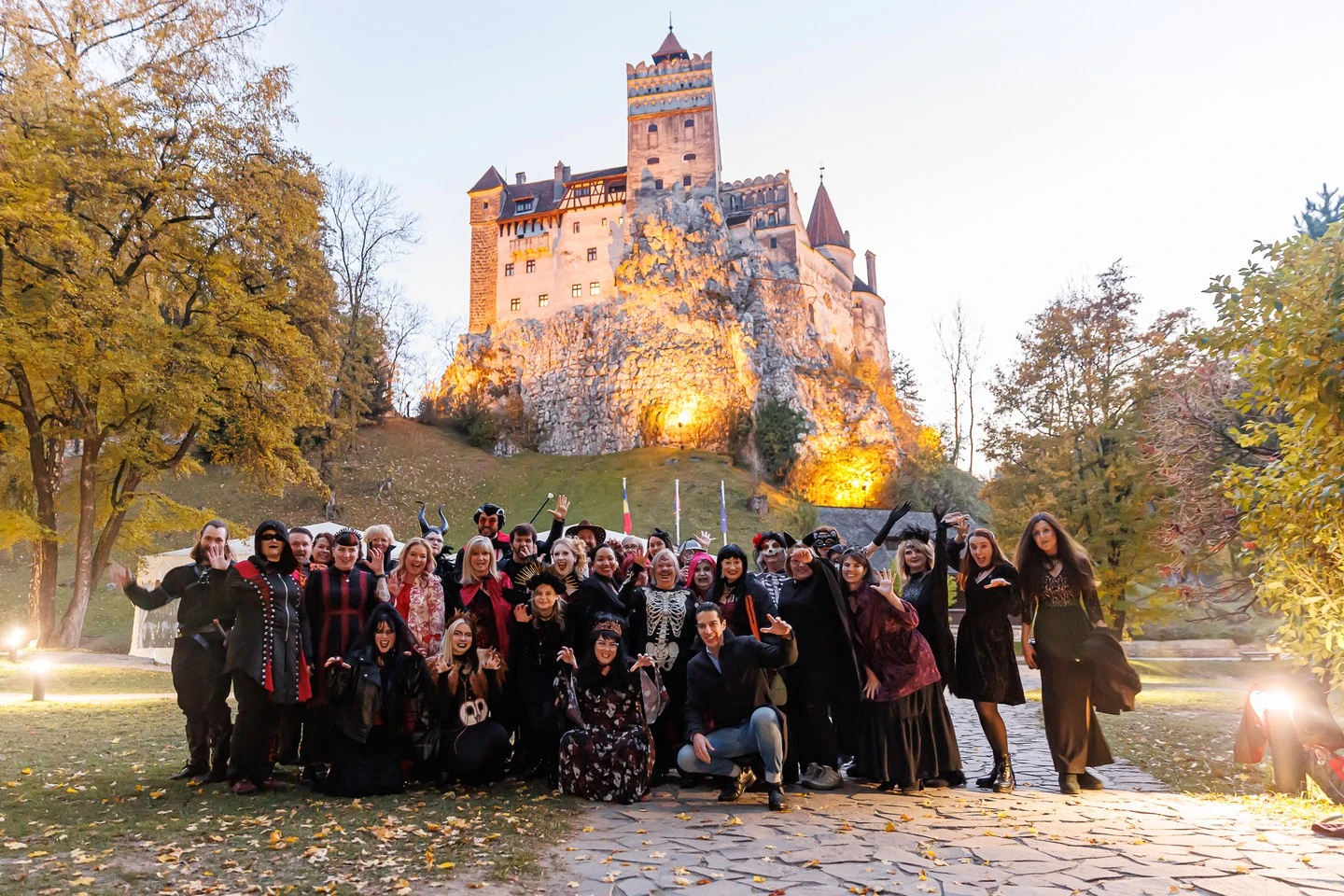 Guests outside historic Transylvanian architecture on an earlier journey